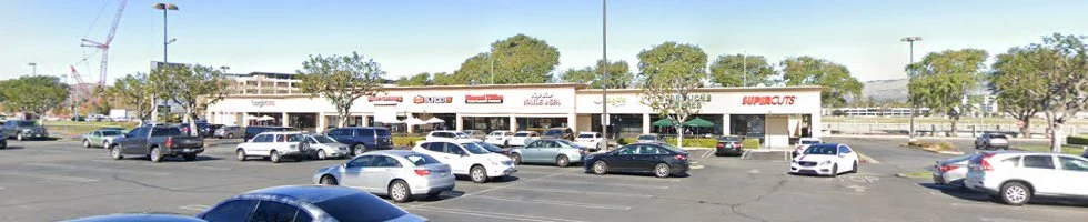 The Victory Boulevard shopping center exterior and parking area